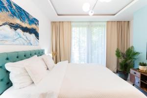 Posteľ alebo postele v izbe v ubytovaní PLATER PREMIUM APARTMENTS
