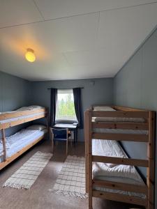 Postel nebo postele na pokoji v ubytování Skoghus