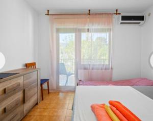 Postel nebo postele na pokoji v ubytování Apartman Arija-Pino