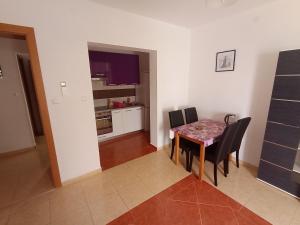 Kuchyň nebo kuchyňský kout v ubytování Apartments Tomi