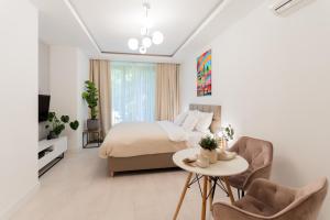 Posteľ alebo postele v izbe v ubytovaní PLATER PREMIUM APARTMENTS