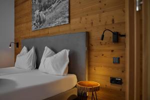Postel nebo postele na pokoji v ubytování Club Haus - Alpin-Resort Montafon Haus 1 by Pferd auf Wolke