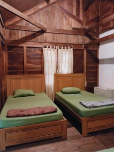 Ένα ή περισσότερα κρεβάτια σε δωμάτιο στο Villa Karet