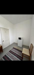 Ένα ή περισσότερα κρεβάτια σε δωμάτιο στο Ferroviária