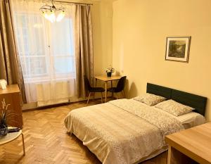 Łóżko lub łóżka w pokoju w obiekcie Apartamenty i Studia HERBARIUM