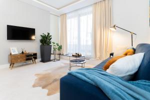 Televízia a/alebo spoločenská miestnosť v ubytovaní PLATER PREMIUM APARTMENTS