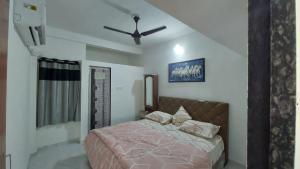 Voodi või voodid majutusasutuse UNiTY MADHAV HOMESTAY toas