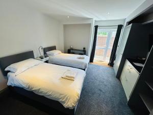 Postel nebo postele na pokoji v ubytování Wessex House