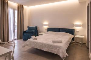 Postel nebo postele na pokoji v ubytování Aura Room