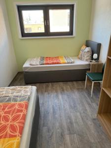 Postel nebo postele na pokoji v ubytování Ferienwohnung Zeitler
