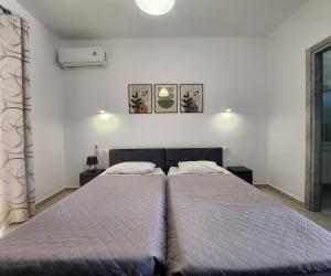 Postel nebo postele na pokoji v ubytování Kos Harmony Apartments
