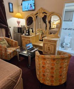 a hotel room with a bed and a mirror at The Royal Guest Lodge in Johannesburg
