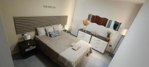 Cama o camas de una habitación en CASA JOSE "Acogedor Apartamento cerca de la playa"