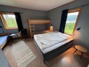Postel nebo postele na pokoji v ubytování Skoghus
