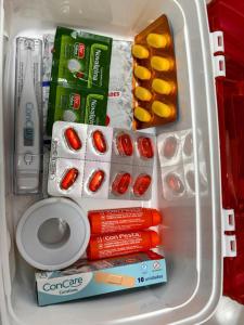 a refrigerator filled with emergency food and medicine at Apartamento Vista Mar 71 in Praia Grande +22 photos