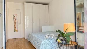 Кровать или кровати в номере Appt 2 Chambres Vue Tour Eiffel