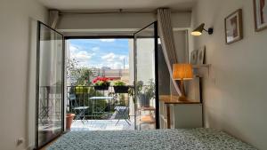 Кровать или кровати в номере Appt 2 Chambres Vue Tour Eiffel