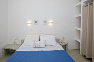 Postel nebo postele na pokoji v ubytování Aster house Agios Sostis + 12 fotografií