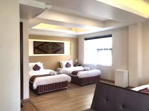 Rúm í herbergi á ViaVia Boutique Hotel - Kathmandu