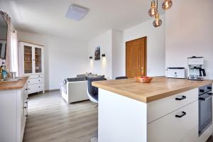 a kitchen with white cabinets and a counter top at Heimatliebe in Garmisch-Partenkirchen