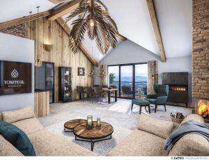 un salon avec un canapé et une table dans l'établissement Tomtegl-Bergchalet-No-2-mit-Privatsauna-Infinitypool-Kamin-Fitnessraum-1500m-Seehoehe, à Hochrindl 1 autre photo