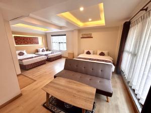 Rúm í herbergi á ViaVia Boutique Hotel - Kathmandu