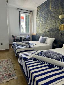 Una cama o camas en una habitación de HOTEL REGINA 37 fotos más
