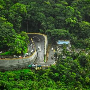 a winding road in the middle of a forest at Dream inn in Meenangadi