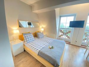 Postel nebo postele na pokoji v ubytování Apartament Węgorzewo przy porcie