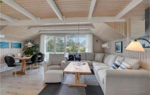 a living room with a couch and a table at Lovely Home In Vestervig With Wifi in Vestervig