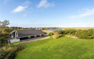 an image of a house with a grass yard at Lovely Home In Vestervig With Wifi in Vestervig +17 photos