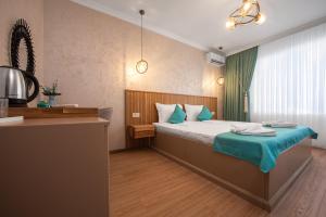 Ένα ή περισσότερα κρεβάτια σε δωμάτιο στο Thaya Rooms