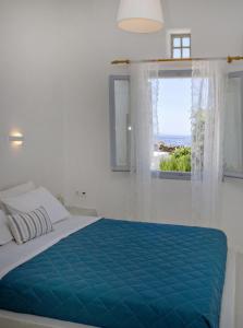 Posteľ alebo postele v izbe v ubytovaní Violet house Agios Sostis