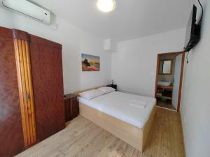 Postel nebo postele na pokoji v ubytování Apartments Lena