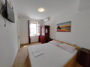 Postel nebo postele na pokoji v ubytování Apartments Lena