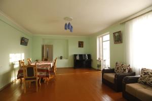 a living room with a table and a couch at David B&B in Sisian
