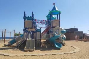 a playground with a slide in the sand at ODESSA, Город у Моря, Ривьера, ЖК Авторский in Fontanka