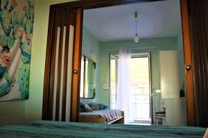 A bed or beds in a room at Una Araucaria sul mare