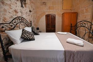 Voodi või voodid majutusasutuse The Cloisters Bed And Breakfast toas