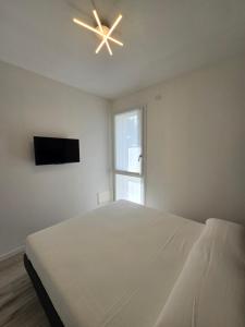 TV a/nebo společenská místnost v ubytování Home23Jesolo! Beach, Parking and Bikes included