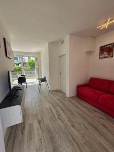 TV a/nebo společenská místnost v ubytování Home23Jesolo! Beach, Parking and Bikes included