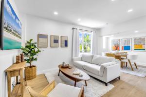 a living room with a couch and a table at Gorgeous coastal PH with Large Private Terrace in Miami Beach