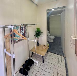 a room with a bathroom with a toilet and a shelf at Inthanon Mountain Camp in Ban Na Yang +61 photos