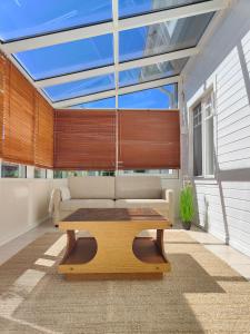 a living room with a couch and a table at The Sunny Villa in Kokkola