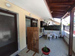a balcony of a house with a table and chairs at Niki's house 2 in Agia Triada