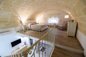 a living room with a staircase leading to a living room at La Chicca nel Centro in Massafra