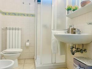 a bathroom with a sink and a toilet and a shower at Salento Holiday Casa Vacanze in Magliano +51 photos