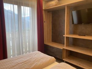 Postel nebo postele na pokoji v ubytování Berg Hotel Latemar Spitze