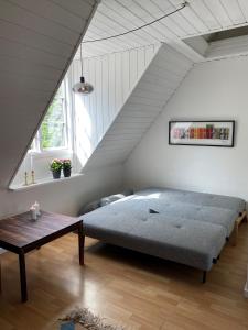 Postel nebo postele na pokoji v ubytování Den Gamle Vandmølle