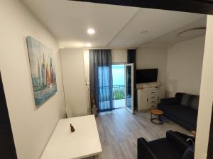 a living room with a couch and a table at Apartment Miranda in Brela
